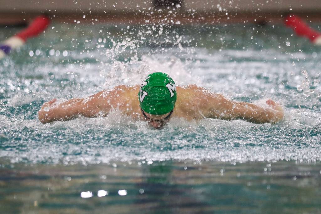 Mount Vernons Wyatt Carlton wins Heat 2 of the 100 Yard Butterfly during the 3A District 1 swim and dive championships at Snohomish Aquatic Center, in Snohomish, Washington on Saturday, Feb. 11, 2023. (Annie Barker / The Herald)
