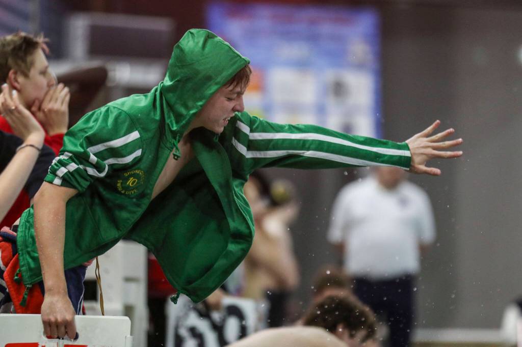 A swimmer cheers during the 3A District 1 swim and dive championships at Snohomish Aquatic Center, in Snohomish, Washington on Saturday, Feb. 11, 2023. (Annie Barker / The Herald)