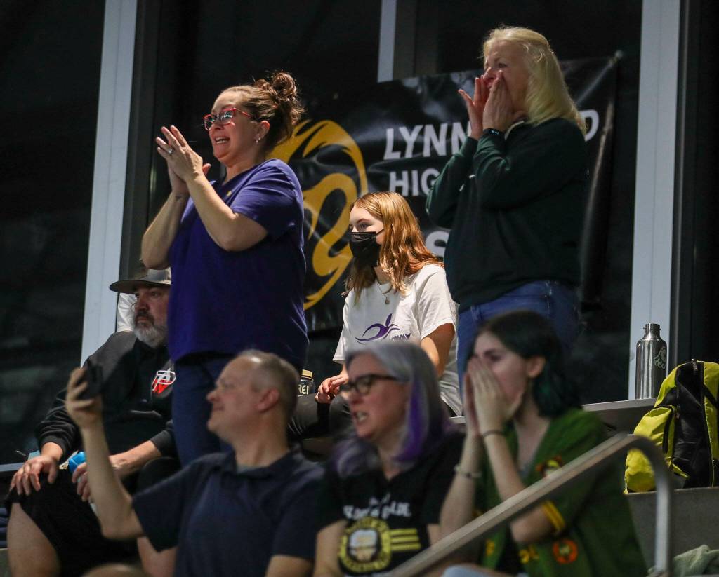 Attendees cheer during the 3A District 1 swim and dive championships at Snohomish Aquatic Center, in Snohomish, Washington on Saturday, Feb. 11, 2023. (Annie Barker / The Herald)