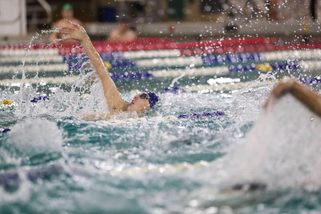 Shorewoods Ben Allen wins Heat 2 of the 100 Yard Backstroke during the 3A District 1 swim and dive championships at Snohomish Aquatic Center, in Snohomish, Washington on Saturday, Feb. 11, 2023. (Annie Barker / The Herald)