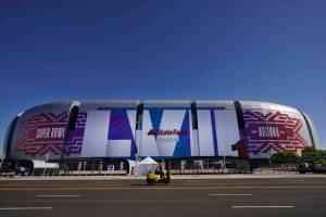 Workers prepare for the NFL Super Bowl LVII football game outside State Farm Stadium, Thursday, Feb. 2, 2023, in Glendale, Ariz. (AP Photo/Matt York)