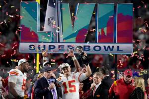 Kansas City Chiefs quarterback Patrick Mahomes (15) holds the Vince Lombardi Trophy while talking to Terry Bradshaw after the NFL Super Bowl 57 football game against the Philadelphia Eagles, Sunday, Feb. 12, 2023, in Glendale, Ariz. The Kansas City Chiefs defeated the Philadelphia Eagles 38-35. (AP Photo/Seth Wenig)