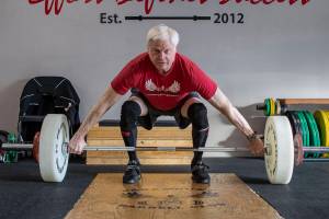 Phil Arnold, 74, practices his lifting techniques at Paramount Strength and Conditioning in Mountlake Terrace, Washington on Thursday, Feb. 2, 2023. The Edmonds resident is 74 and recently retired as an attorney. He took up weightlifting after retirement and recently won a national championship. (Annie Barker / The Herald)