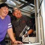 Cindy Montgomery with her son, Ryan Gobin, owner of Ryans REZ-ipes, laugh at the antics of patron Friday afternoon at Skookum Brewery in Arlington on October 14, 2022. (Kevin Clark / The Herald)