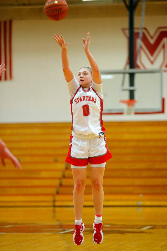 Stanwoods Grace Walker hits a three in a win over Snohomish on Tuesday, Feb. 14, 2023, at Marysville Pilchuck High School in Marysville, Washington. (Ryan Berry / The Herald)