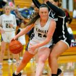 Arlingtons Katie Snow gets to the basket for a layup against Lynnwood on Tuesday, Feb. 14, 2023, at Marysville Pilchuck High School in Marysville, Washington. (Ryan Berry / The Herald)