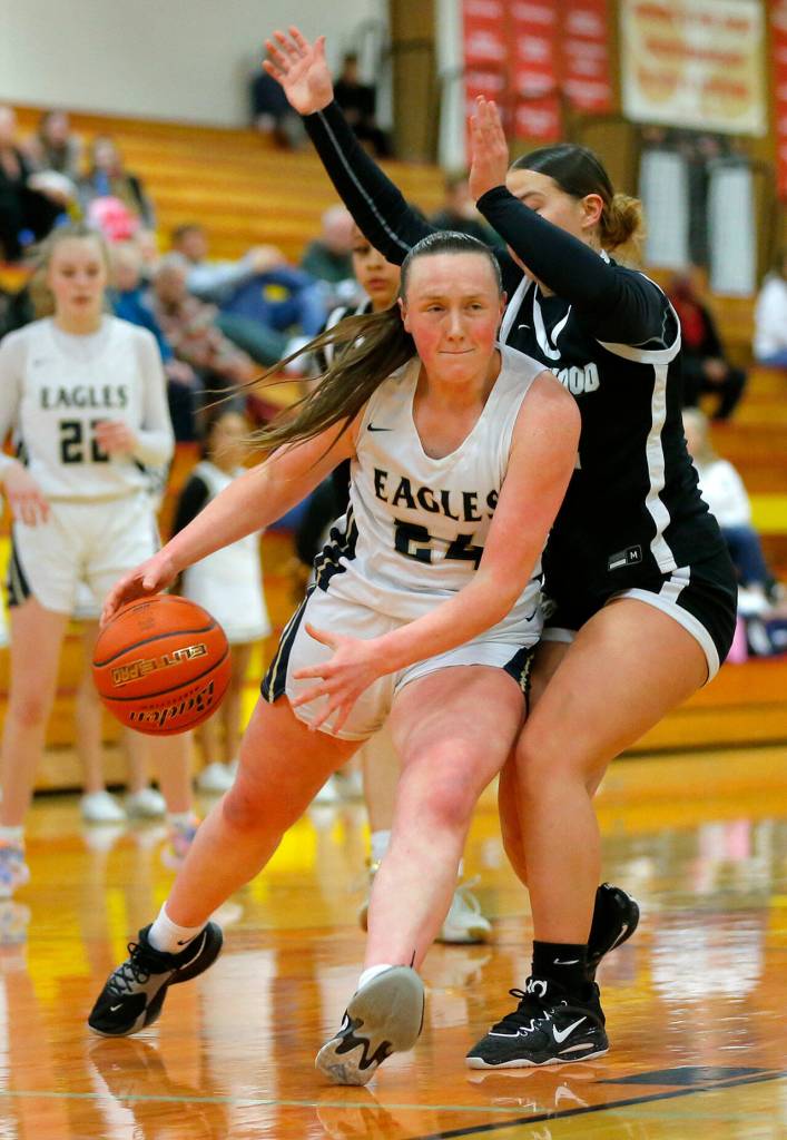 Arlingtons Katie Snow gets to the basket for a layup against Lynnwood on Tuesday, Feb. 14, 2023, at Marysville Pilchuck High School in Marysville, Washington. (Ryan Berry / The Herald)
