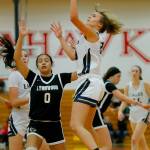 Arlingtons Samara Morrow puts up a floater against Lynnwood on Tuesday, Feb. 14, 2023, at Marysville Pilchuck High School in Marysville, Washington. (Ryan Berry / The Herald)