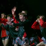 Stanwood wrestlers react to a pin during a match against Arlington on Jan. 24 in Arlington. The Spartans qualified 11 wrestlers for Mat Classic XXXIV and have team title aspirations this weekend. (Olivia Vanni / The Herald)