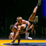 Stanwoods Tyler Rhue (top) is the second-ranked wrestlers at 132 pounds in Class 3A. (Olivia Vanni / The Herald)