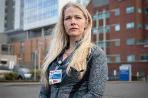 Katy Roth, RN, outside of Providence Regional Medical Center Everett where she has worked for more than 9 years on Friday, Feb. 17, 2023 in Everett, Washington. (Olivia Vanni / The Herald)
