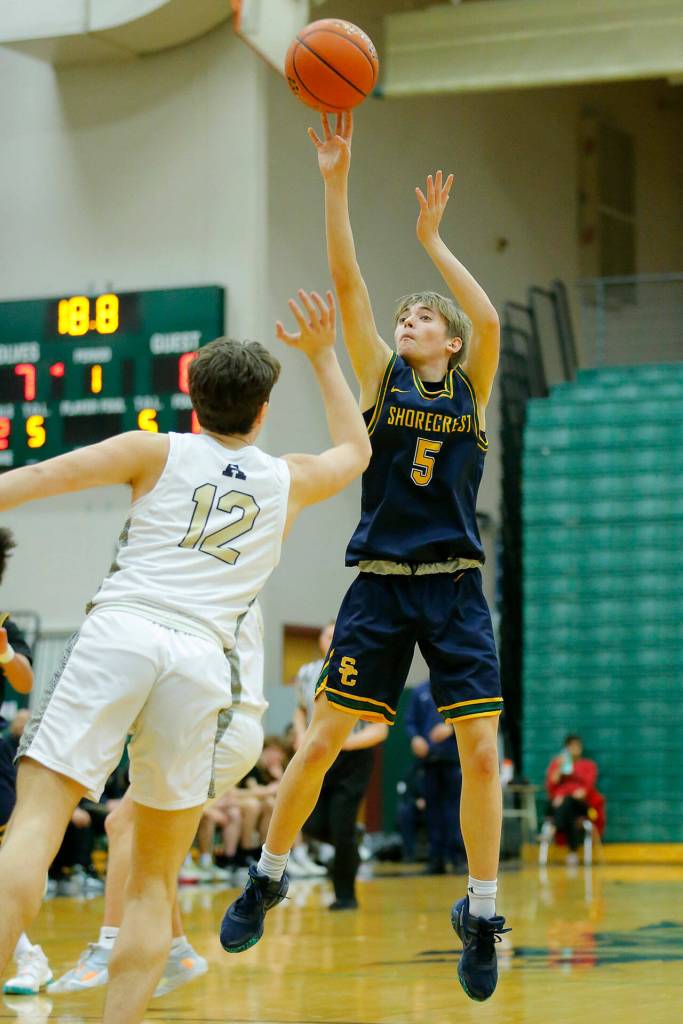 Shorecrests Brayden Fischer puts up a three against Arlington on Wednesday, Feb. 15, 2023, at Jackson High School in Mill Creek, Washington. (Ryan Berry / The Herald)