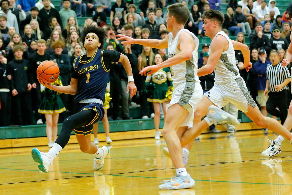 Shorecrests Keaine Silimon beats the defense for a fast break layup against Arlington on Wednesday, Feb. 15, 2023, at Jackson High School in Mill Creek, Washington. (Ryan Berry / The Herald)