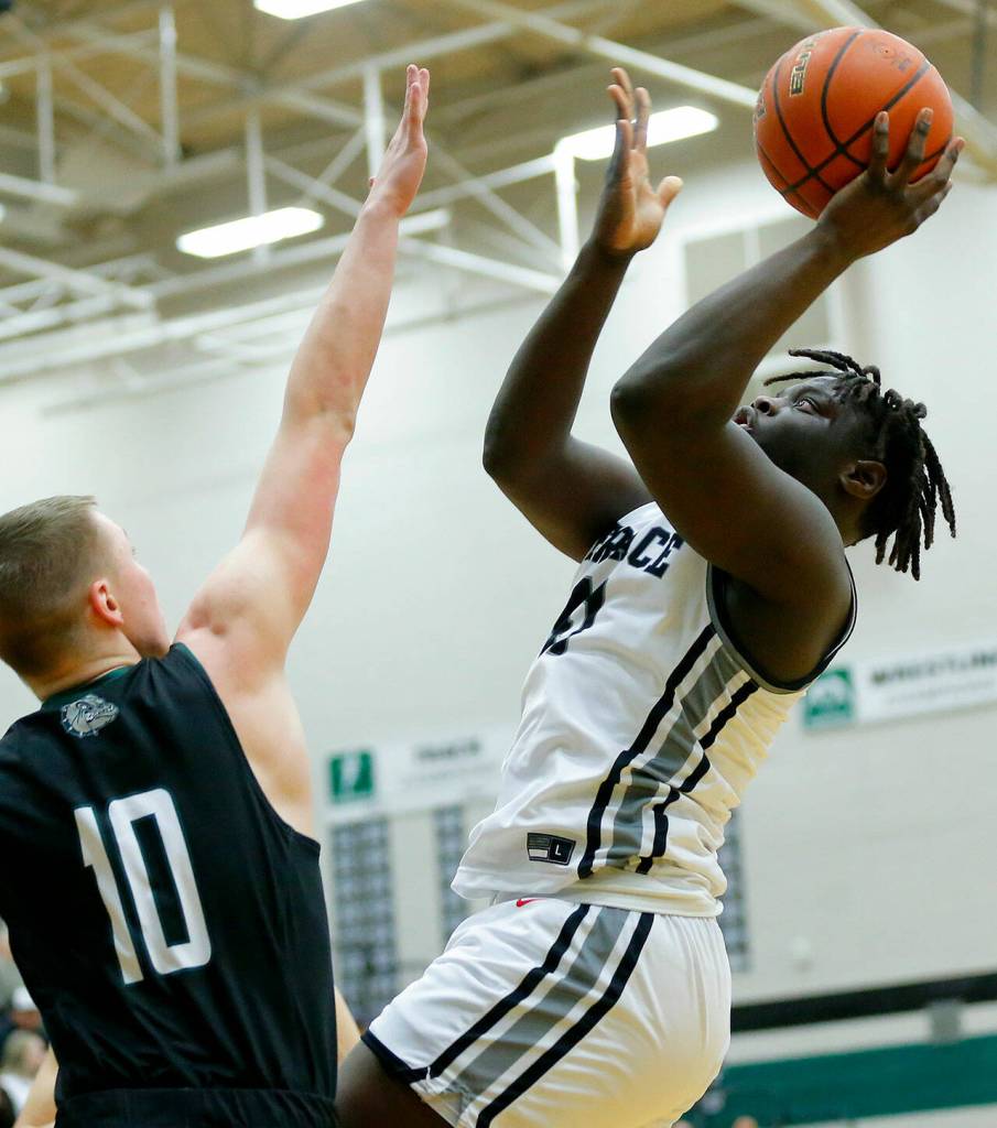 Mountlake Terraces Zaveon Jones tries for the putback shot against Mount Vernon on Wednesday, Feb. 15, 2023, at Jackson High School in Mill Creek, Washington. (Ryan Berry / The Herald)
