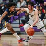 Mariners Jailin Johnson (2) and Jacksons Trey Hawkins (3) fight for the ball during a game between Jackson and Mariner at Lake Washington High School in Kirkland, Washington on Thursday, Feb. 16, 2023. After an intense back-and-forth in the final period Mariner defeated Jackson, 77-76. (Annie Barker / The Herald)