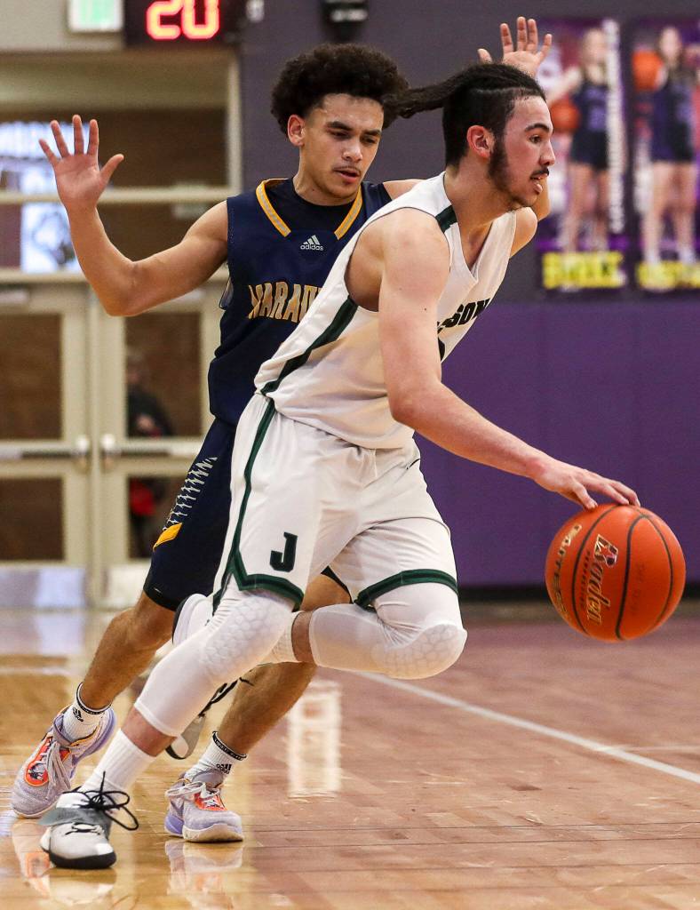 Jacksons Trey Hawkins (3) moves with the ball during a game between Jackson and Mariner at Lake Washington High School in Kirkland, Washington on Thursday, Feb. 16, 2023. After an intense back-and-forth in the final period Mariner defeated Jackson, 77-76. (Annie Barker / The Herald)