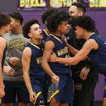 Mariner players react after winning a game between Jackson and Mariner at Lake Washington High School in Kirkland, Washington on Thursday, Feb. 16, 2023. After an intense back-and-forth in the final period Mariner defeated Jackson, 77-76. (Annie Barker / The Herald)