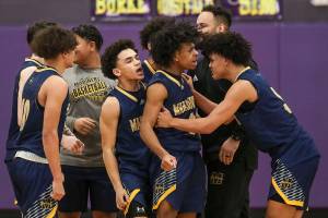 Mariner players react after winning a game between Jackson and Mariner at Lake Washington High School in Kirkland, Washington on Thursday, Feb. 16, 2023. After an intense back-and-forth in the final period Mariner defeated Jackson, 77-76. (Annie Barker / The Herald)