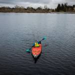 Dave Ellingson, 75, paddles around Lake Ballinger for practice on Saturday, Feb. 18, in Mountlake Terrace. (Olivia Vanni / The Herald)