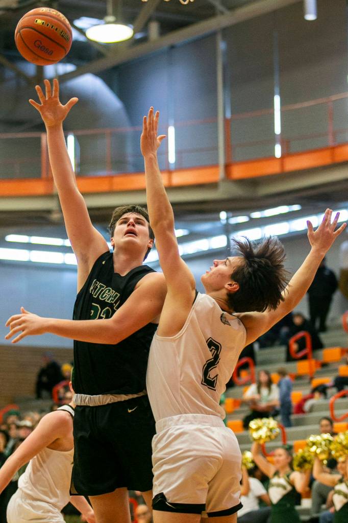 Marysville-Getchells Wyatt Harris attempts a layup during the game against Mount Vernon on Friday, Feb. 17, 2023 in Everett, Washington. (Olivia Vanni / The Herald)