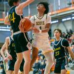 Shorecrests Keaine Silimon attempts a layup while being guarded during the game against Everett on Friday, Feb. 17, 2023 in Everett, Washington. (Olivia Vanni / The Herald)