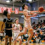 Shorecrests Parker Baumann makes an open layup during the game against Everett on Friday, Feb. 17, 2023 in Everett, Washington. (Olivia Vanni / The Herald)