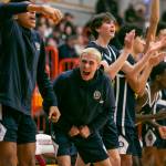 The Everett bench reacts to a three point shot during the game against Shorecrest on Friday, Feb. 17, 2023 in Everett, Washington. (Olivia Vanni / The Herald)