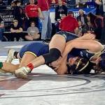 Arlingtons Danielle Crew (top) wrestles Kelsos Bella Victoriano in the quarterfinals of the 4A/3A girls 115-pound weight class during the first day of Mat Classic XXXIV on Feb. 17, 2023, at the Tacoma Dome. Crew won by pinfall to reach the state semifinals. (Zac Hereth / The Herald)