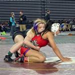 Kamiaks Rebecca Serati (left) wrestles Pascos Elisa Sanchez in a 4A/3A girls 105-pound match during the first day of Mat Classic XXXIV on Feb. 17, 2023, at the Tacoma Dome. (Zac Hereth / The Herald)