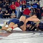 Arlington's Danielle Crew (top) wrestles Kelso's Bella Victoriano in the quarterfinals of the 4A/3A girls 115-pound weight class during the first day of Mat Classic XXXIV on Feb. 17, 2023, at the Tacoma Dome. Crew won by pinfall to reach the state semifinals. (Zac Hereth / The Herald)