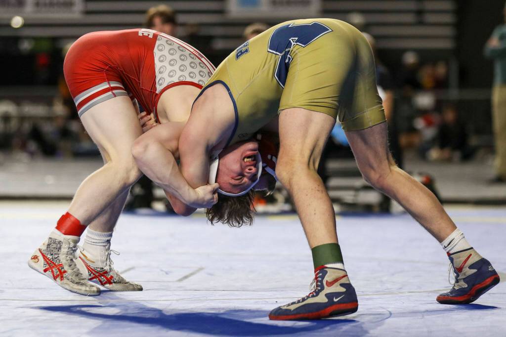 Stanwoods Tyler Rhue and Meads Josh Neiwert wrestle during the 3A Boys 132-pound championship match during the Mat Classic XXXIV at the Tacoma Dome in Tacoma, Washington on Saturday, Feb. 18, 2023. (Annie Barker / The Herald)