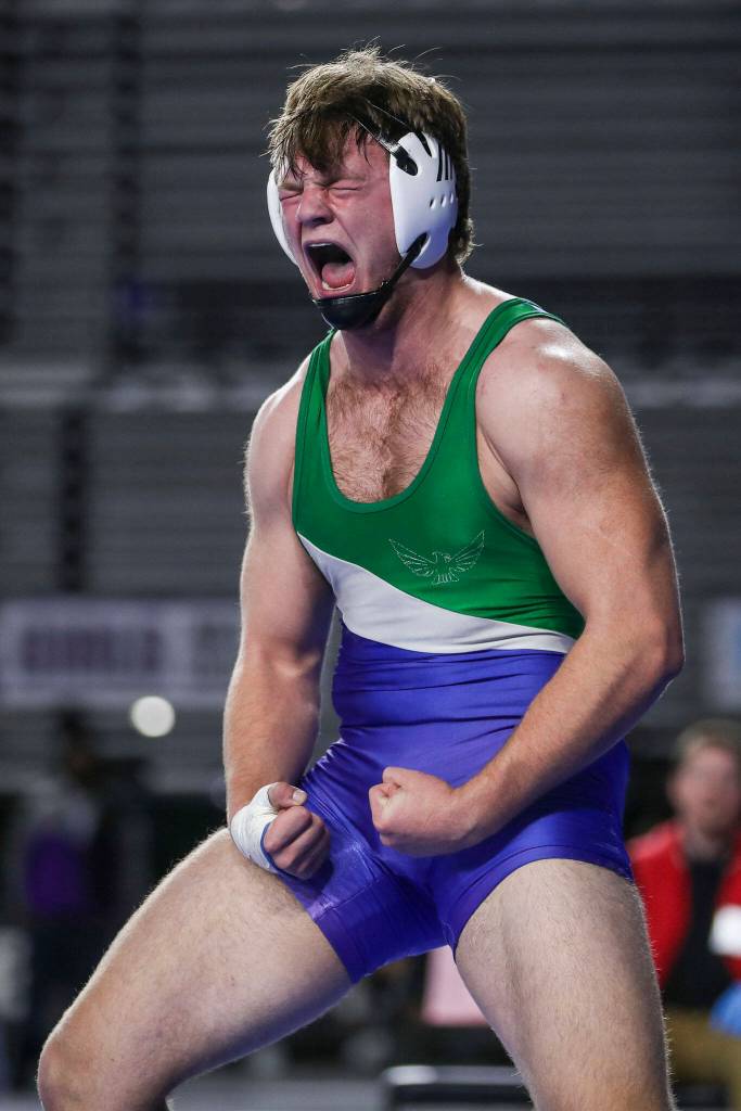 Shorewoods Hunter Tibodeau celebrates winning the 3A Boys 220-pound championship match during the Mat Classic XXXIV at the Tacoma Dome in Tacoma, Washington on Saturday, Feb. 18, 2023. (Annie Barker / The Herald)