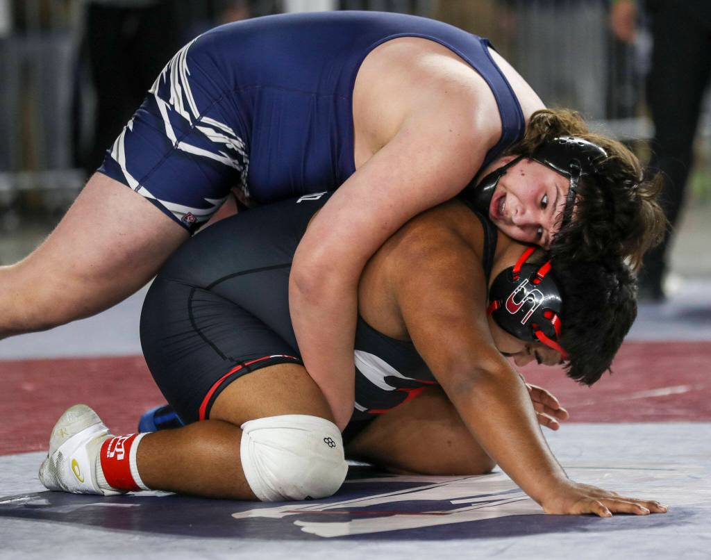 Glacier Peaks Connor Aney and Sunnysides Mateo Armendariz wrestle during the 4A Boys 285-pound championship match during the Mat Classic XXXIV at the Tacoma Dome in Tacoma, Washington on Saturday, Feb. 18, 2023. (Annie Barker / The Herald)