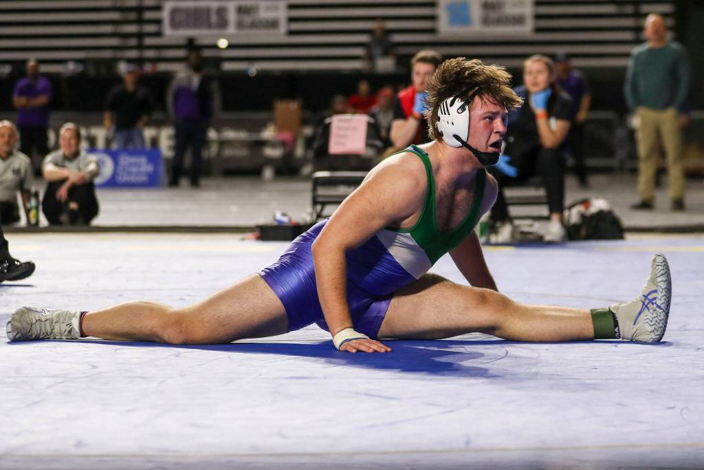 Shorewoods Hunter Tibodeau celebrates winning the 3A Boys 220-pound championship match during the Mat Classic XXXIV at the Tacoma Dome in Tacoma, Washington on Saturday, Feb. 18, 2023. (Annie Barker / The Herald)