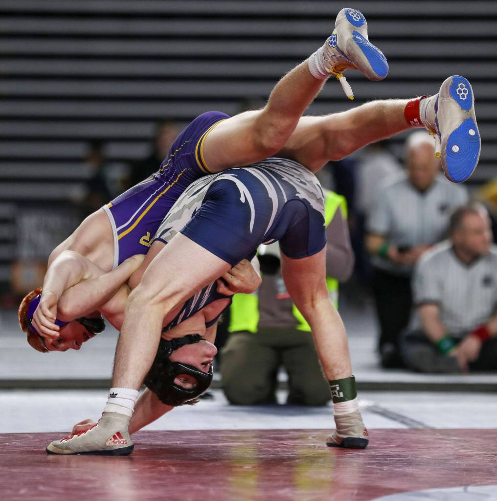Sumners Cody Miller and Glacier Peaks Gil Mossburg wrestle during the 4A Boys 145-pound championship match during the Mat Classic XXXIV at the Tacoma Dome in Tacoma, Washington on Saturday, Feb. 18, 2023. (Annie Barker / The Herald)