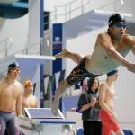 Jackson junior Ethan Chen-Parks dives in as the second swimmer for his team during the 200 yard freestyle relay final at the 4A WIAA Boys High School Swim and Dive Championships on Friday, Feb. 18, 2023, at the Weyerhaeuser King County Aquatic Center in Federal Way, Washington. (Ryan Berry / The Herald)