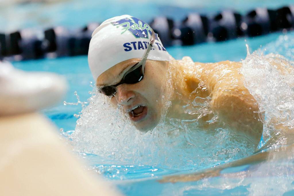 Woodinville senior Alex Popov takes the final turn in the 100 yard breaststroke consolation at the 4A WIAA Boys High School Swim and Dive Championships on Friday, Feb. 18, 2023, at the Weyerhaeuser King County Aquatic Center in Federal Way, Washington. (Ryan Berry / The Herald)
