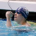 Glacier Peaks Kaiu Taylor pumps his fist after finishing the 50 yard freestyle consolation race at the 4A WIAA Boys High School Swim and Dive Championships on Friday, Feb. 18, 2023, at the Weyerhaeuser King County Aquatic Center in Federal Way, Washington. (Ryan Berry / The Herald)