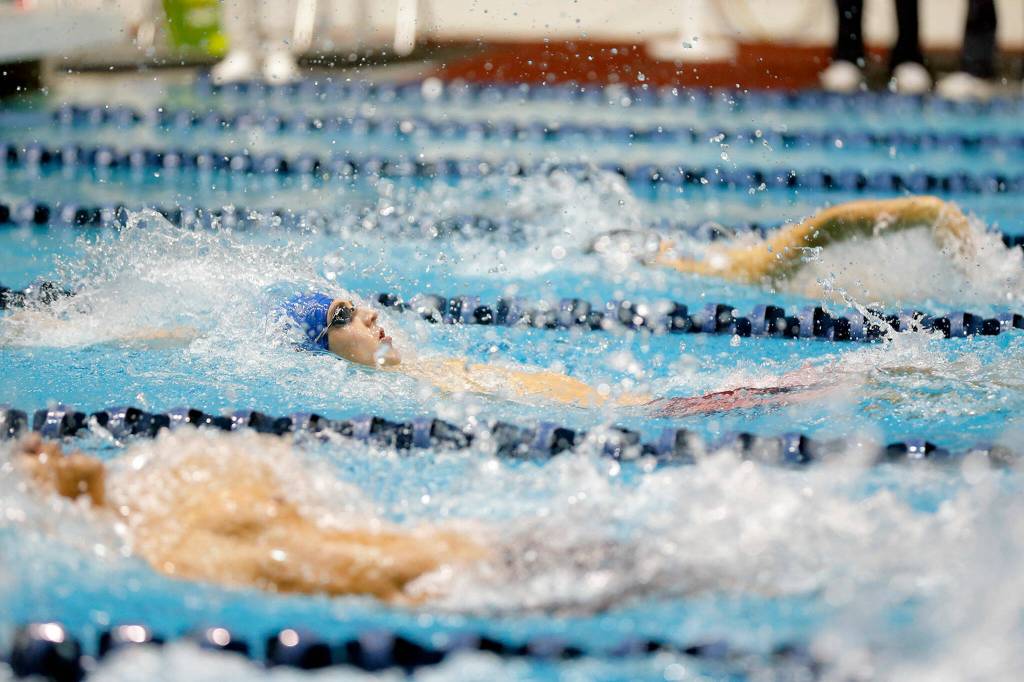 Shorewood junior Ben Allen leads off his team in the 200 yard medley relay consolation at the 3A WIAA Boys High School Swim and Dive Championships on Friday, Feb. 18, 2023, at the Weyerhaeuser King County Aquatic Center in Federal Way, Washington. (Ryan Berry / The Herald)
