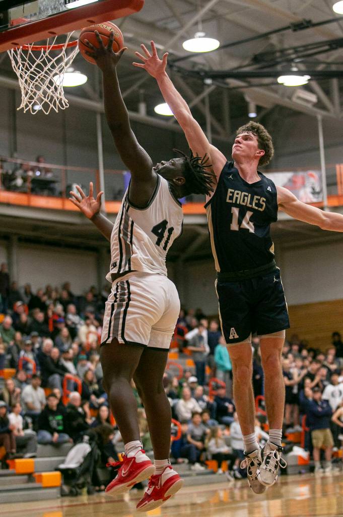 Mountlake Terraces Zaveon Jones makes a layup during the game against Arlington on Saturday, Feb. 18, 2023 in Everett, Washington. (Olivia Vanni / The Herald)