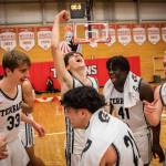 Mountlake Terrace players celebrate beating Arlington to become the 3A District 1 champions on Saturday, Feb. 18, 2023 in Everett, Washington. (Olivia Vanni / The Herald)