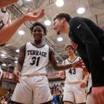 Mountlake Terrace players celebrate beating Arlington to become the 3A District 1 champions on Saturday, Feb. 18, 2023 in Everett, Washington. (Olivia Vanni / The Herald)
