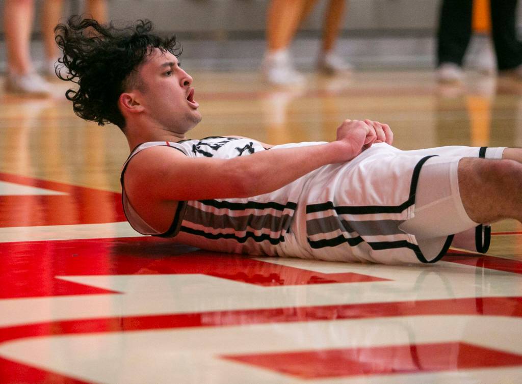 Mountlake Terraces Logan Tews reacts to drawing a foul call during the game against Arlington on Saturday, Feb. 18, 2023 in Everett, Washington. (Olivia Vanni / The Herald)