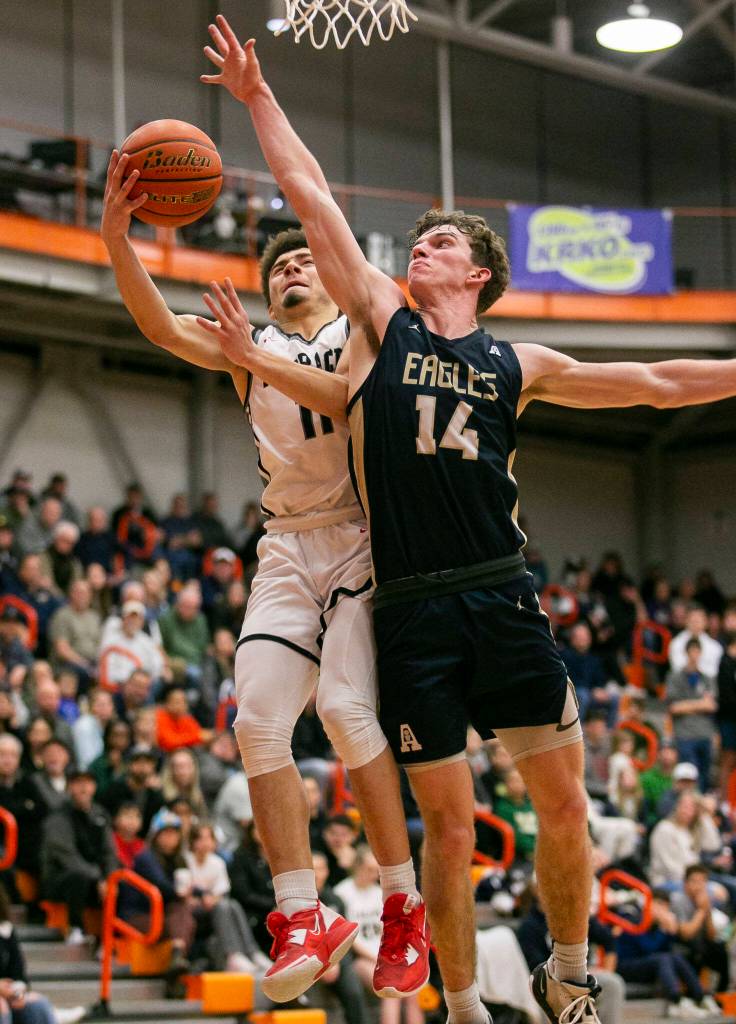 Mountlake Terraces Chris Meegan attempts a layup during the game against Arlington on Saturday, Feb. 18, 2023 in Everett, Washington. (Olivia Vanni / The Herald)