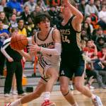 Mountlake Terraces Jaxon Dubiel drives to the hoop during the game against Arlington on Saturday, Feb. 18, 2023 in Everett, Washington. (Olivia Vanni / The Herald)