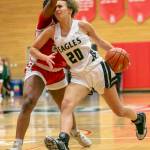 Arlingtons Samara Morrow is fouled as she drives to the hoop during the game against Stanwood on Saturday, Feb. 18, 2023 in Everett, Washington. (Olivia Vanni / The Herald)