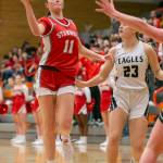 Stanwoods Tatum Brager attempts to pass the pall to a teammate during the game against Arlington on Saturday, Feb. 18, 2023 in Everett, Washington. (Olivia Vanni / The Herald)