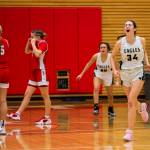 Arlingtons Jenna Villa yells in celebration after beating Stanwood to become 3A District 1 champions on Saturday, Feb. 18, 2023 in Everett, Washington. (Olivia Vanni / The Herald)