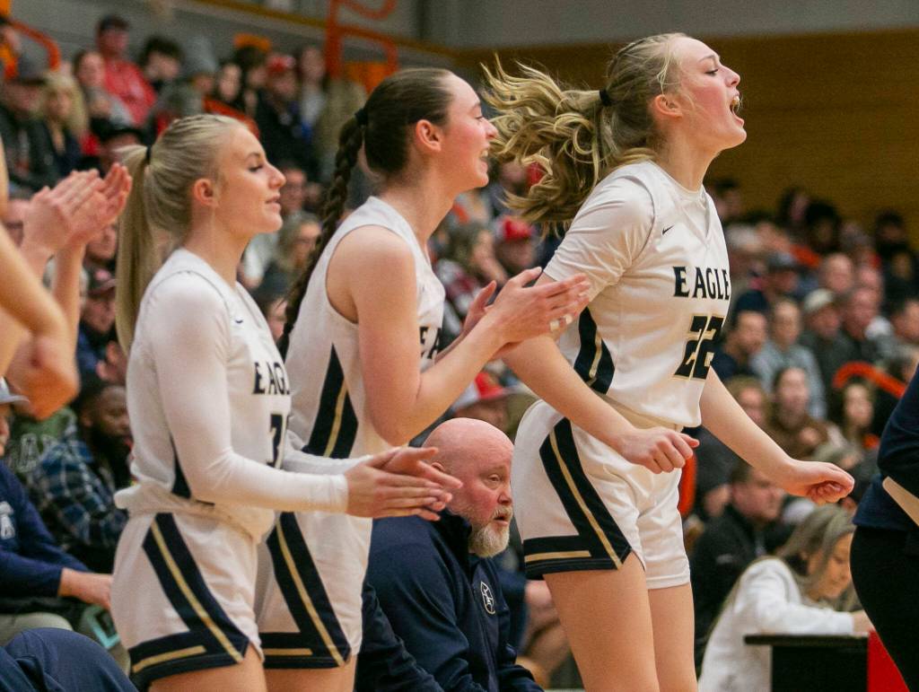 Arlingtons Kierra Reese yells in reaction to a score by a teammate during the game against Stanwood on Saturday, Feb. 18, 2023 in Everett, Washington. (Olivia Vanni / The Herald)
