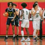 Everetts Isaiah White is congratulated by teammate Daniel Savovic after drawing a foul in the final seconds of the game against Marysville Getchell on Saturday, Feb. 18, 2023 in Everett, Washington. (Olivia Vanni / The Herald)